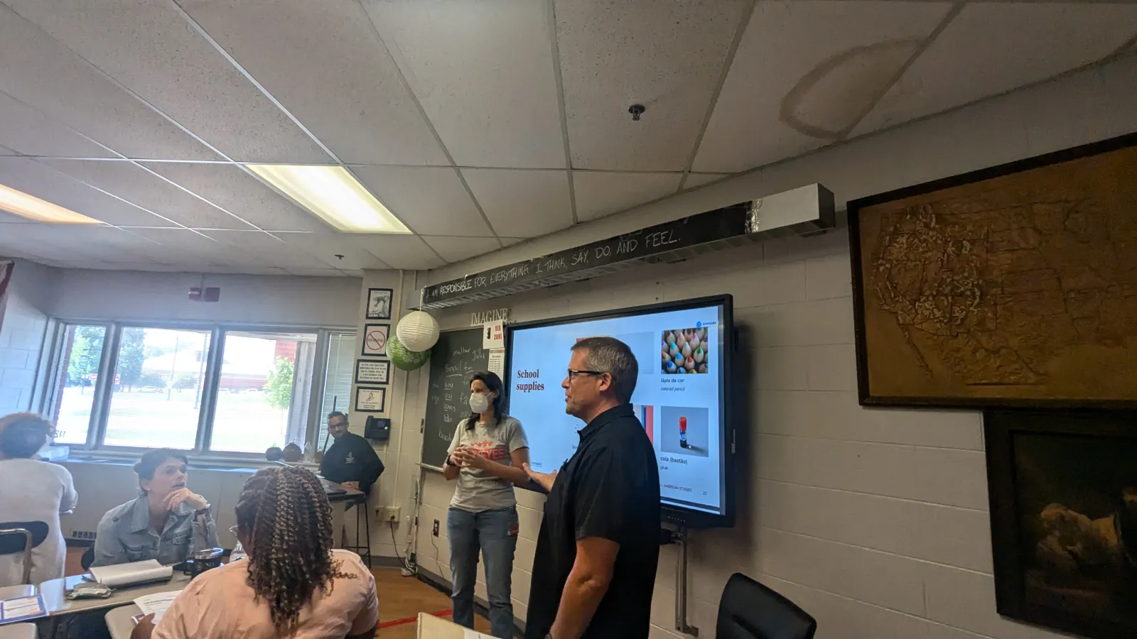 Scott, Leila and Julio presenting in a classroom