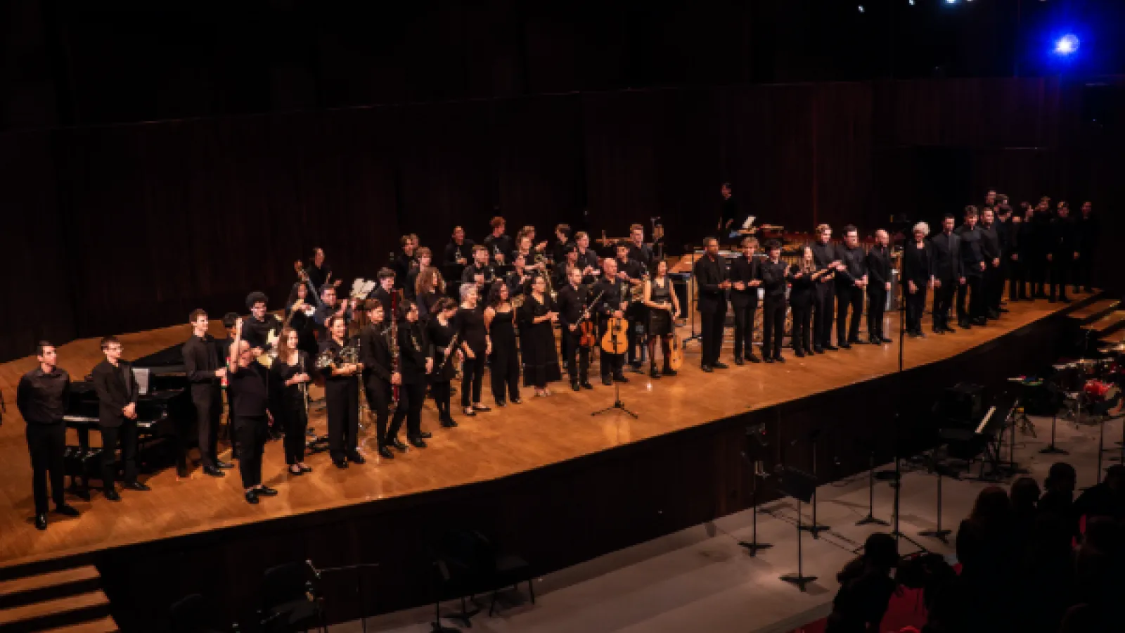 Performers at the Latin American Music Celebration Final Concert gather on stage to take a bow.
