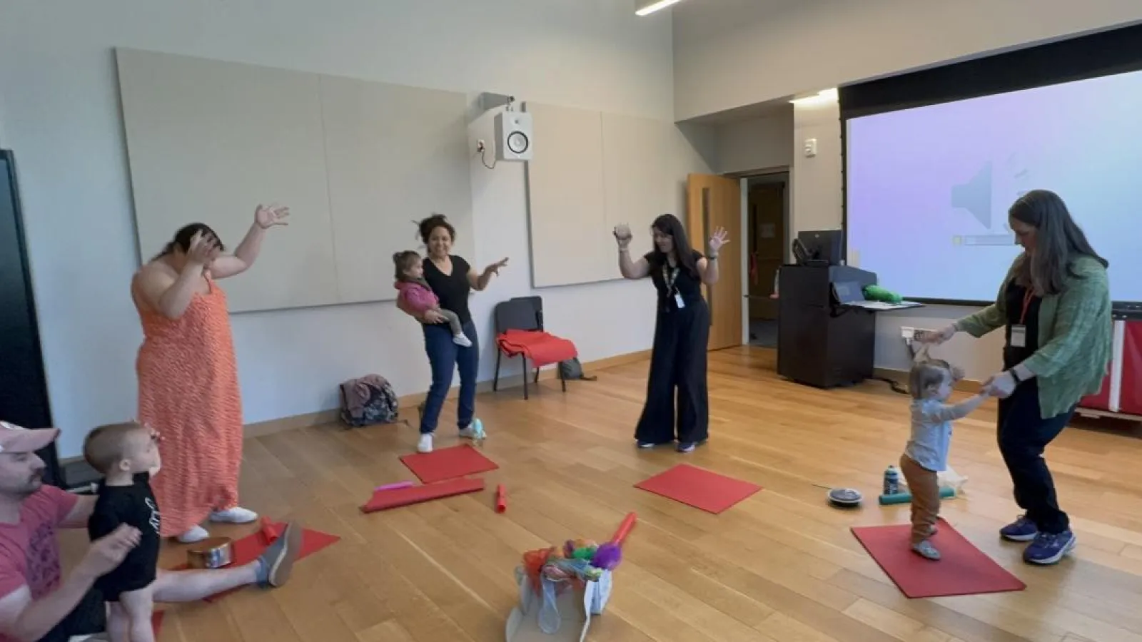 parents and babies dancing in a music class
