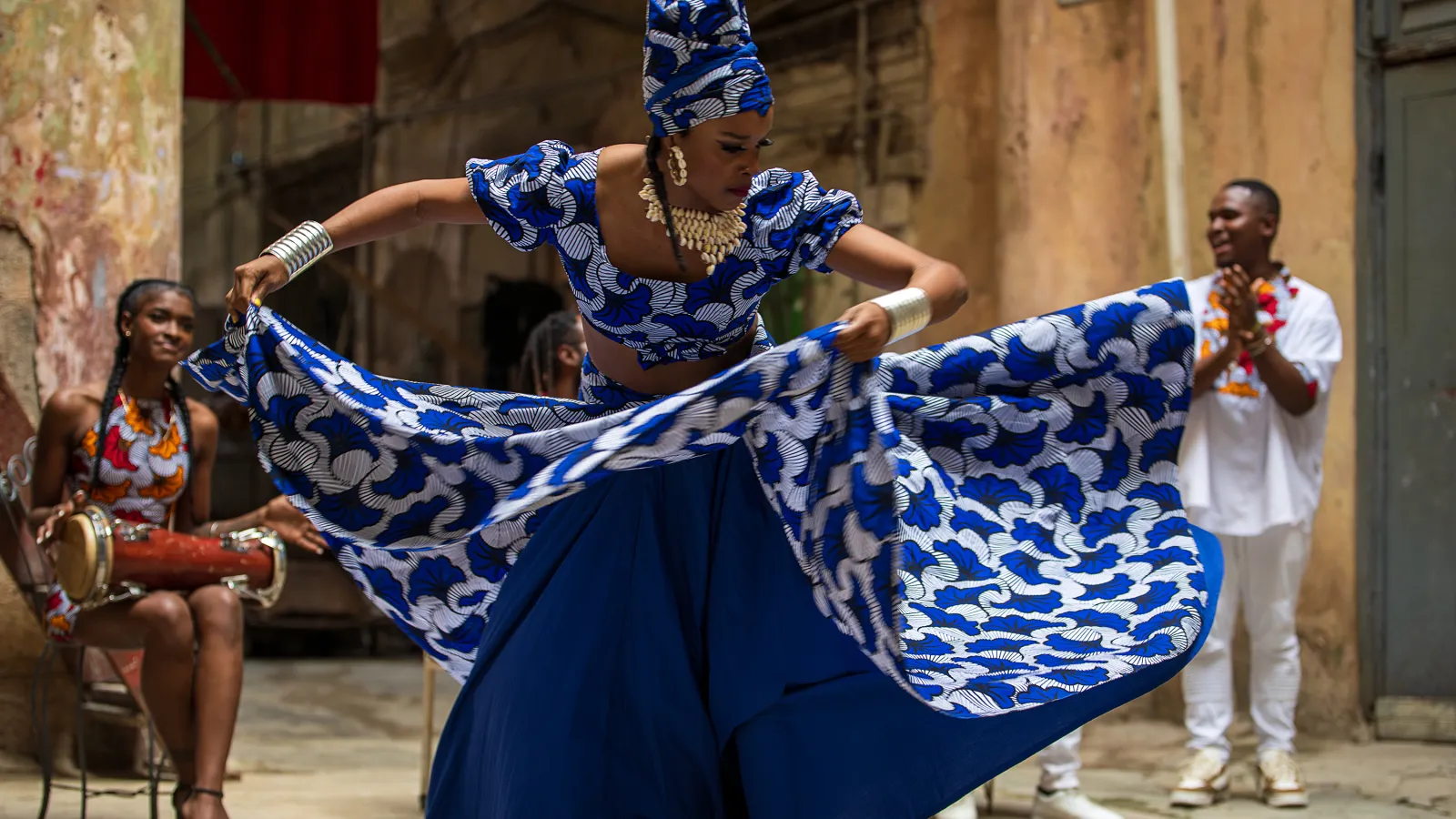 woman dancing in blue dress