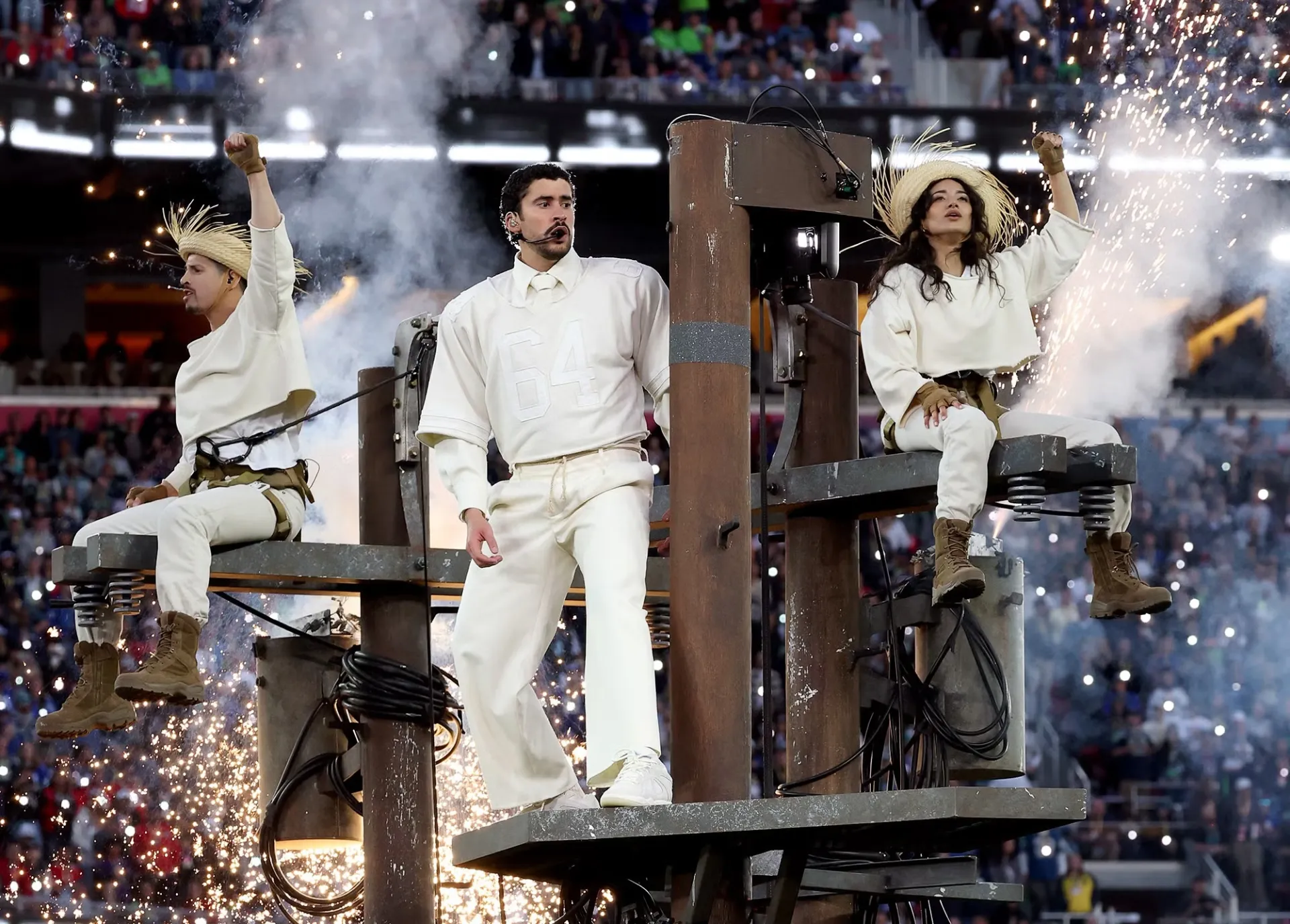 bad bunny in white on top of electricity pole (Kevin Mazur / Getty Images for Roc Nation)