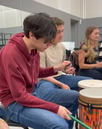 Students playing the drums